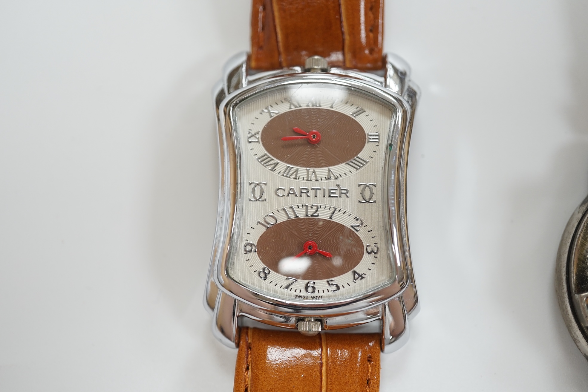 A group of assorted modern wrist watches including Sekonda, Camel and Timex Snoopy, together with two alarm clocks including Mickey Mouse. Condition - poor to fair